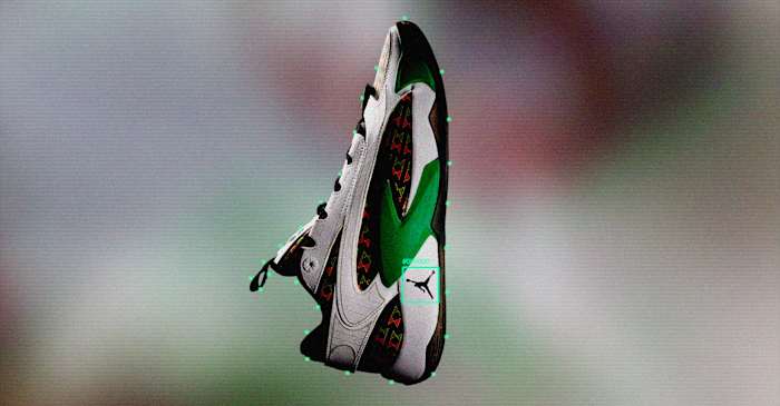 Side view of Luka Doncic's white, black, and green Jordan Brand shoes.